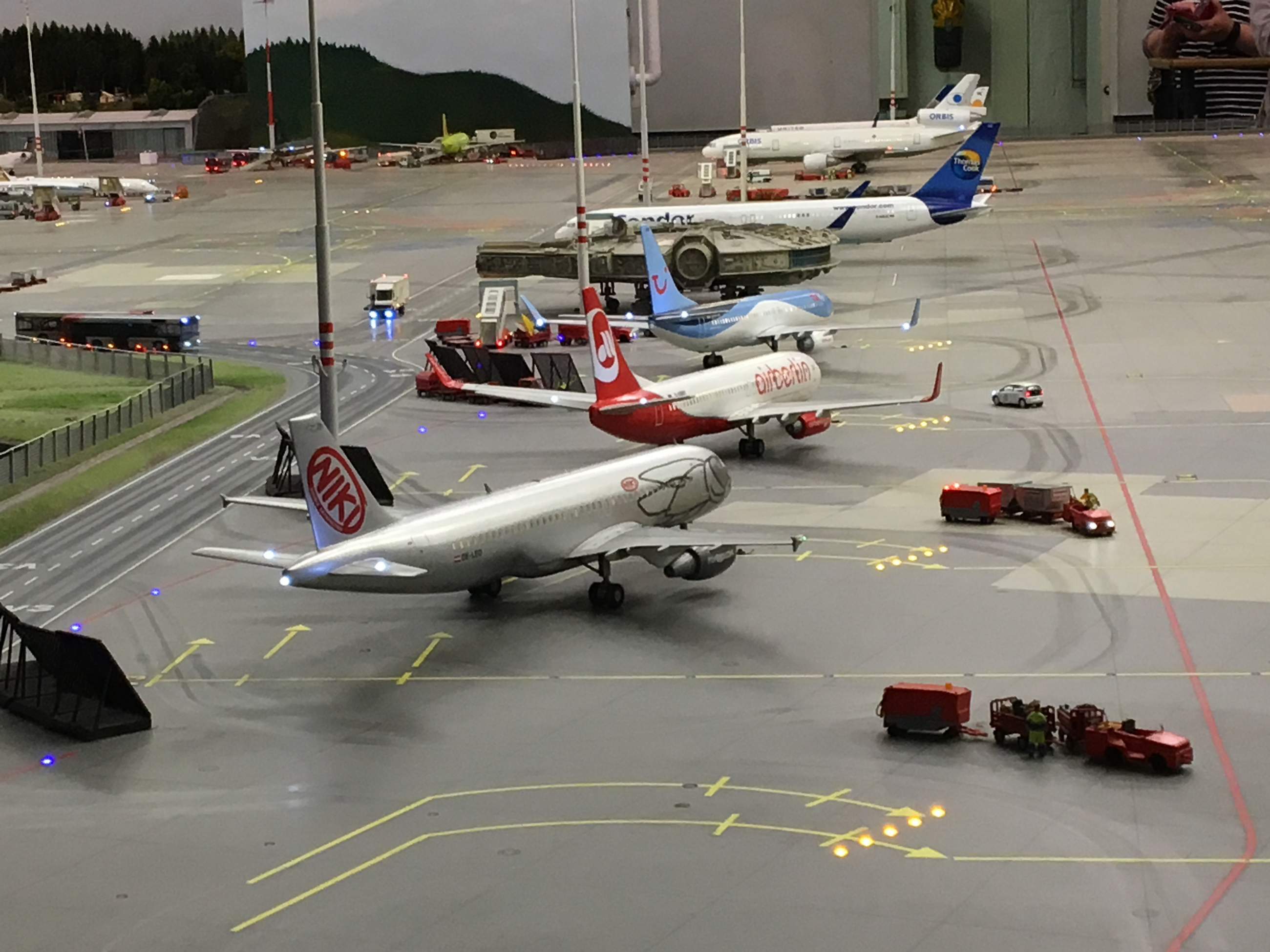 Miniature airplanes parked on the ground at the model airport